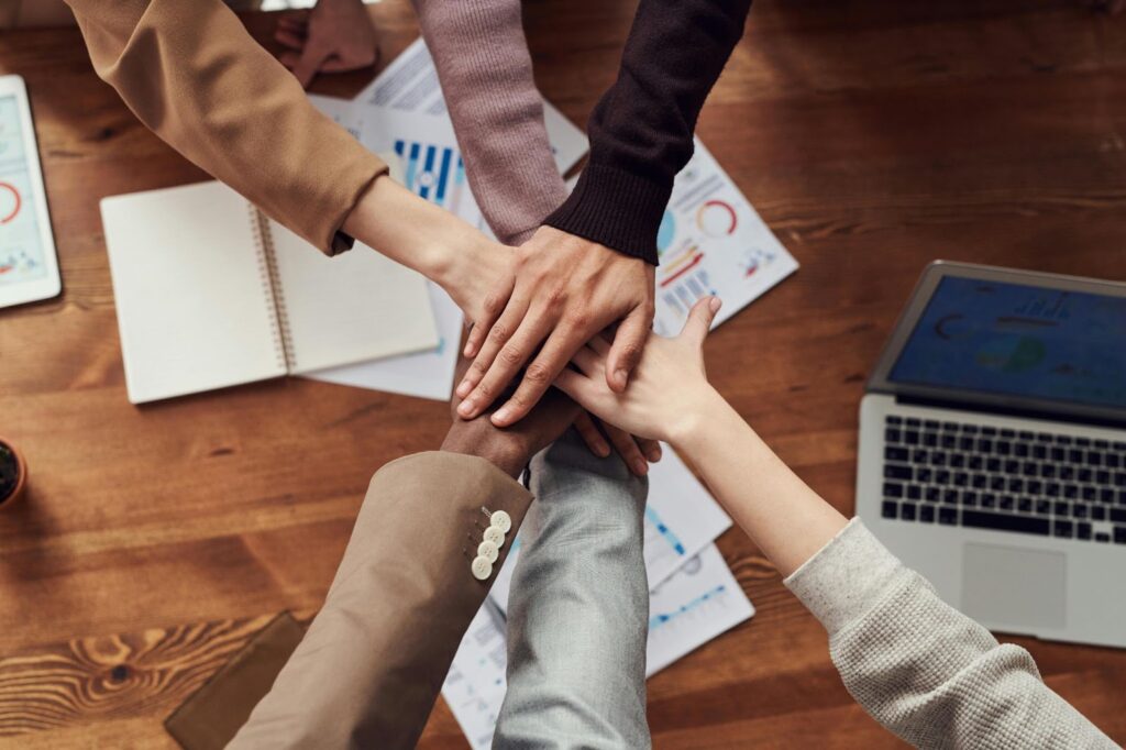 Group of people demonstrating teamwork, reflecting the concept of 'Understanding Guanxi in Business.