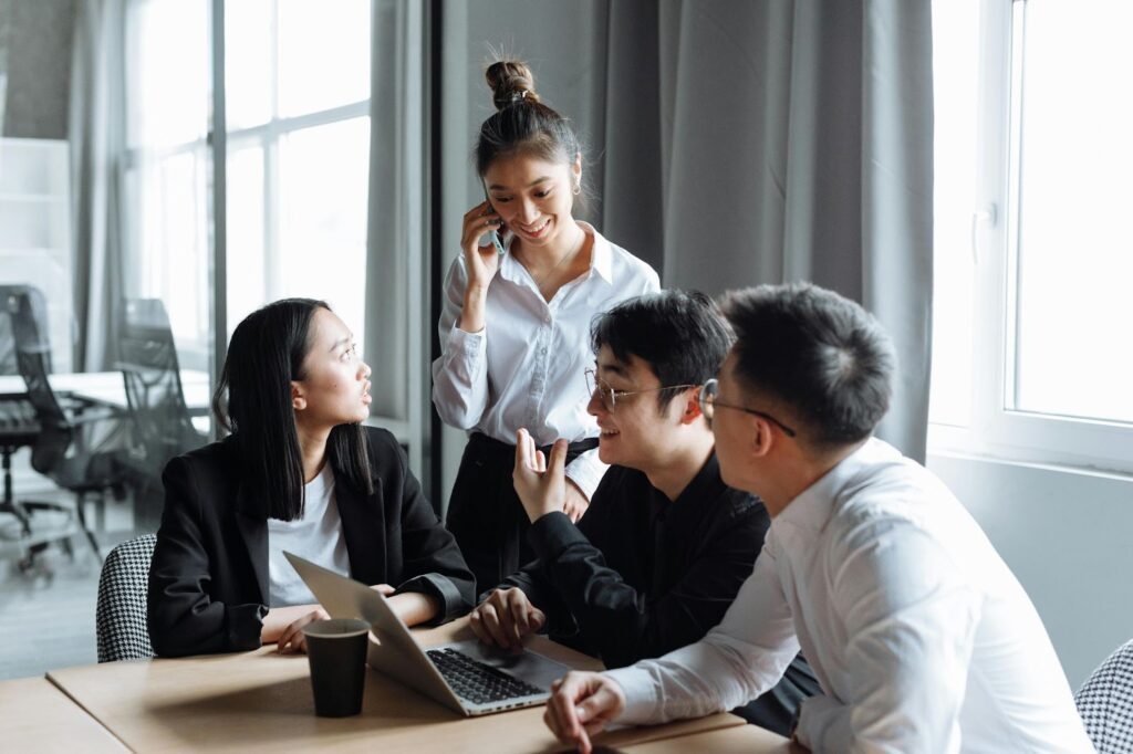 Group of people meeting in the office to discuss managing relationships with stakeholders.